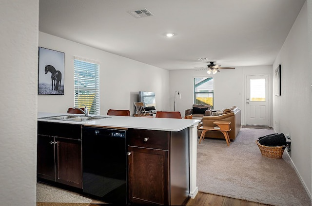 175 Amber Gln, Maxwell, TX 78656 - kitchen with black dishwasher, light countertops, a ceiling fan, dark brown cabinets, and open floor plan