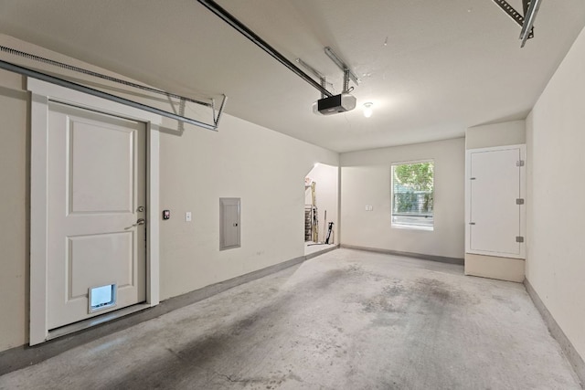 1601 Miriam Ave Unit 216, Austin, TX 78702 - garage featuring a garage door opener and electric panel