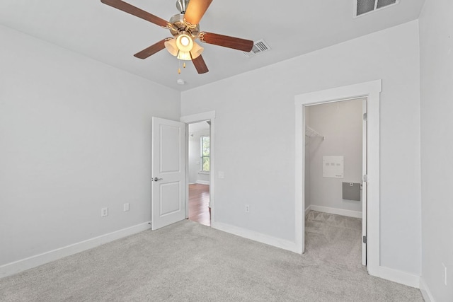1601 Miriam Ave Unit 216, Austin, TX 78702 - unfurnished bedroom with a spacious closet, carpet floors, and a ceiling fan