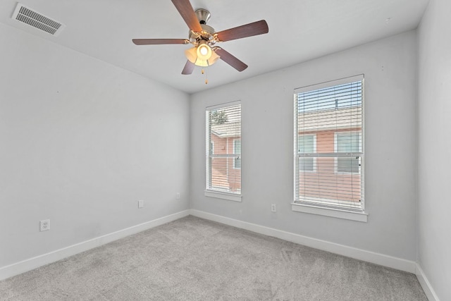1601 Miriam Ave Unit 216, Austin, TX 78702 - spare room featuring carpet floors and a ceiling fan