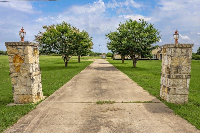 144 Escondido Dr, Del Valle, TX 78617 - view of home's community with a lawn