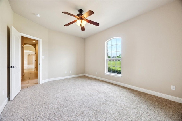 144 Escondido Dr, Del Valle, TX 78617 - unfurnished room with carpet flooring, a ceiling fan, arched walkways, and a smoke detector