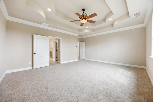 144 Escondido Dr, Del Valle, TX 78617 - empty room featuring light colored carpet, a raised ceiling, ceiling fan, ornamental molding, and recessed lighting