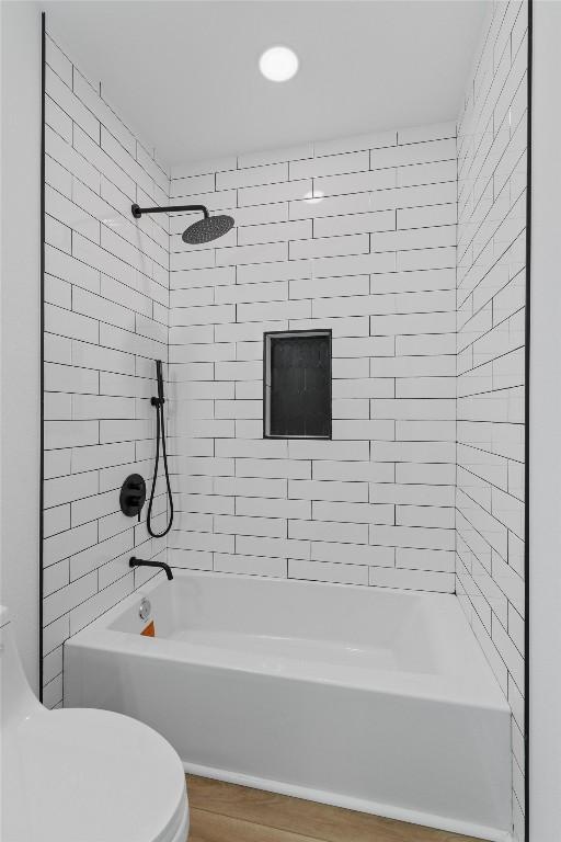 901 Church St N, Georgetown, TX 78626 - full bath featuring bathtub / shower combination, wood finished floors, and recessed lighting