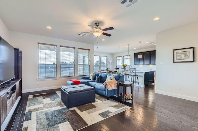 3025 Lions Tail St, Austin, TX 78728 - living area featuring a ceiling fan, dark wood-type flooring, and recessed lighting