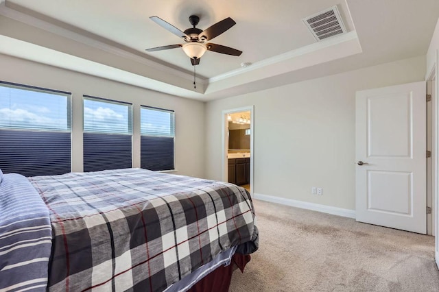 3025 Lions Tail St, Austin, TX 78728 - bedroom with a raised ceiling, ornamental molding, light colored carpet, a ceiling fan, and ensuite bath