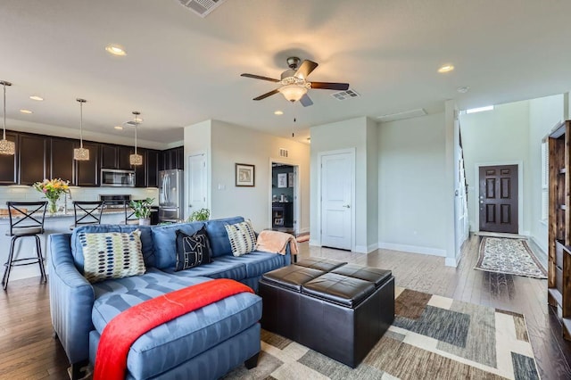 3025 Lions Tail St, Austin, TX 78728 - living area featuring ceiling fan, light wood finished floors, and recessed lighting