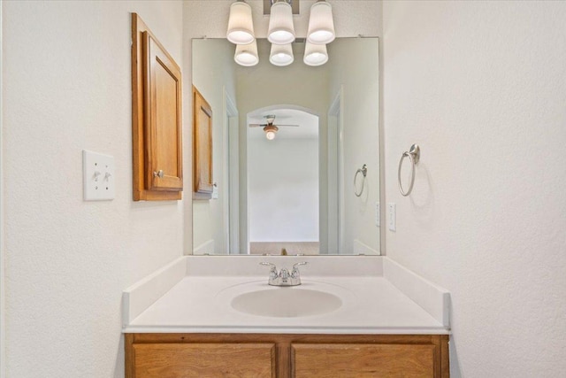 102 Country View Way, Cedar Park, TX 78613 - bathroom with vanity, a ceiling fan, and a textured wall
