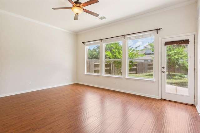 102 Country View Way, Cedar Park, TX 78613 - unfurnished room featuring healthy amount of natural light, wood finished floors, a ceiling fan, and ornamental molding