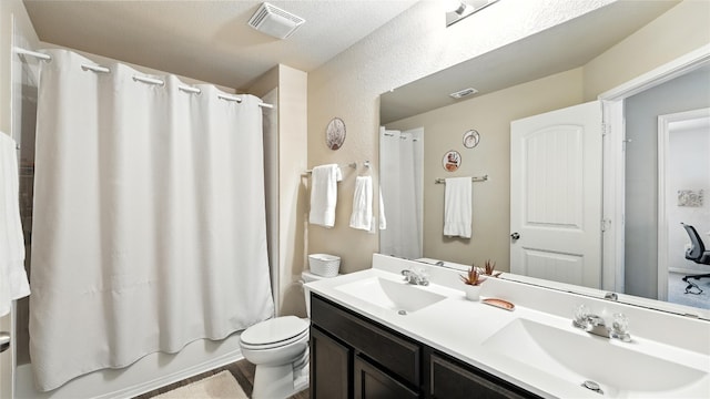 201 Garcitas Creek Ln, Hutto, TX 78634 - bathroom featuring double vanity and shower / tub combo with curtain
