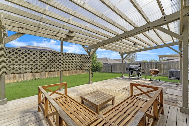 201 Garcitas Creek Ln, Hutto, TX 78634 - fenced backyard with a deck, a pergola, and grilling area