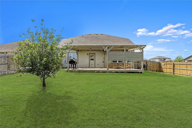 201 Garcitas Creek Ln, Hutto, TX 78634 - rear view of house featuring a fenced backyard and a wooden deck
