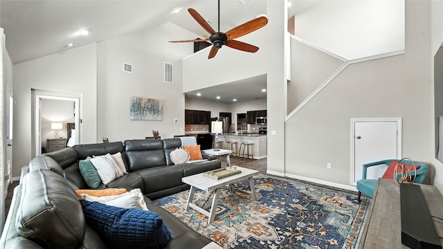 201 Garcitas Creek Ln, Hutto, TX 78634 - living room with ceiling fan, high vaulted ceiling, and wood finished floors