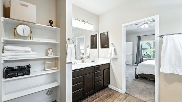201 Garcitas Creek Ln, Hutto, TX 78634 - bathroom with a ceiling fan, double vanity, wood finished floors, and ensuite bathroom
