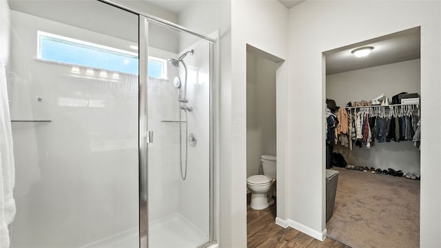 201 Garcitas Creek Ln, Hutto, TX 78634 - full bath with a stall shower, a walk in closet, and wood finished floors