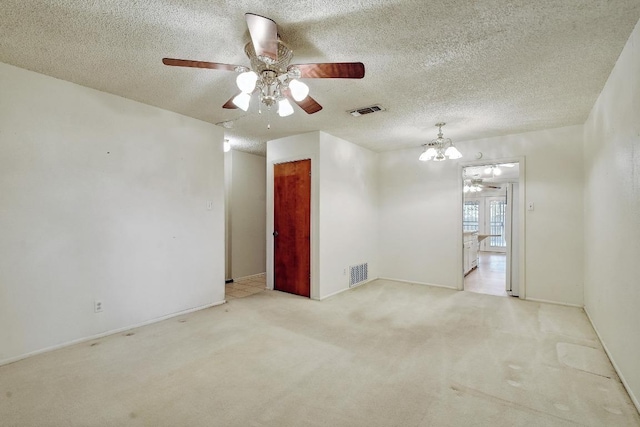 7546 Leafy Hollow Ct, Live Oak, TX 78233 - carpeted spare room featuring ceiling fan, a chandelier, and a textured ceiling