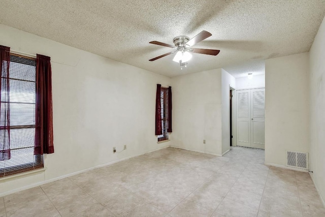 7546 Leafy Hollow Ct, Live Oak, TX 78233 - unfurnished room featuring a ceiling fan and a textured ceiling