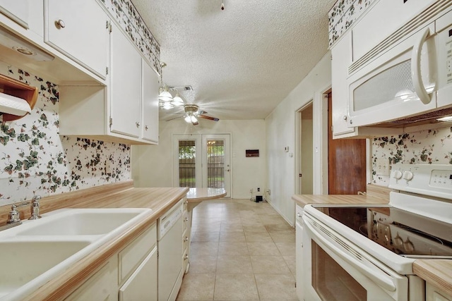7546 Leafy Hollow Ct, Live Oak, TX 78233 - kitchen featuring white appliances, ceiling fan, a textured ceiling, light countertops, and light tile patterned floors