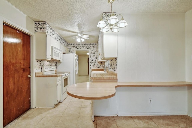 7546 Leafy Hollow Ct, Live Oak, TX 78233 - kitchen with white appliances, ceiling fan, a textured ceiling, light countertops, and white cabinets