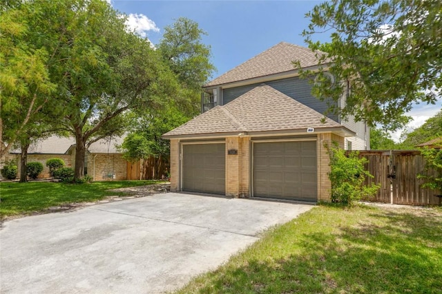 1912 Gaylord Dr, Austin, TX 78728 - view of property exterior with driveway, roof with shingles, brick siding, an attached garage, and a gate
