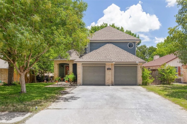 1912 Gaylord Dr, Austin, TX 78728 - view of front of property featuring a garage, concrete driveway, brick siding, and a shingled roof