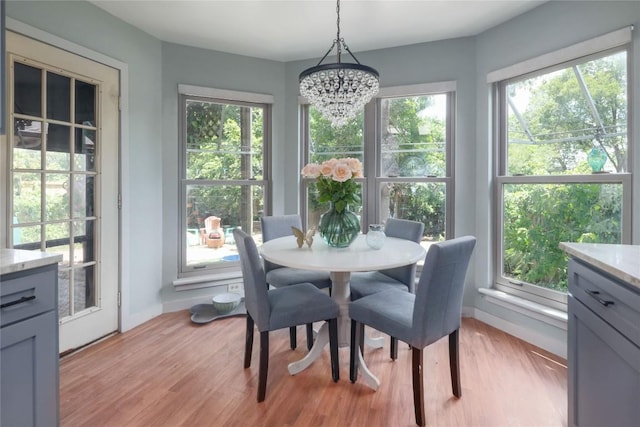 1912 Gaylord Dr, Austin, TX 78728 - dining space with a chandelier, healthy amount of natural light, and light wood-type flooring