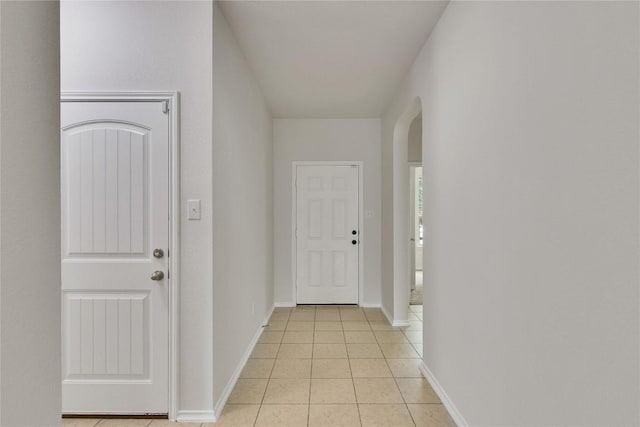 933 Oatmeal Dr, Pflugerville, TX 78660 - corridor with arched walkways and light tile patterned floors