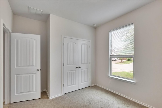 933 Oatmeal Dr, Pflugerville, TX 78660 - unfurnished bedroom with light colored carpet and a closet