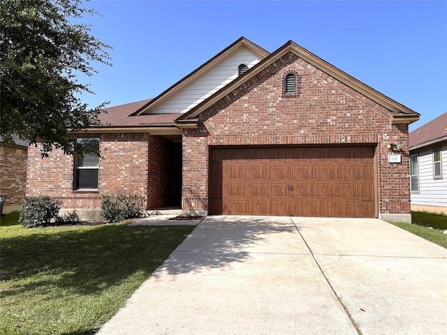 933 Oatmeal Dr, Pflugerville, TX 78660 - ranch-style home with brick siding, an attached garage, a front lawn, and driveway