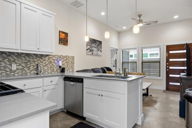 720 Pedernales St Unit B, Austin, TX 78702 - kitchen with stainless steel dishwasher, a peninsula, a ceiling fan, decorative backsplash, and white cabinetry