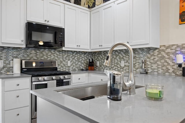 720 Pedernales St Unit B, Austin, TX 78702 - kitchen with black microwave, gas range, white cabinetry, backsplash, and light stone countertops