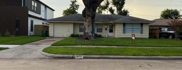 8050 Montridge Dr, Houston, TX 77055 - ranch-style house featuring concrete driveway, an attached garage, and a front yard