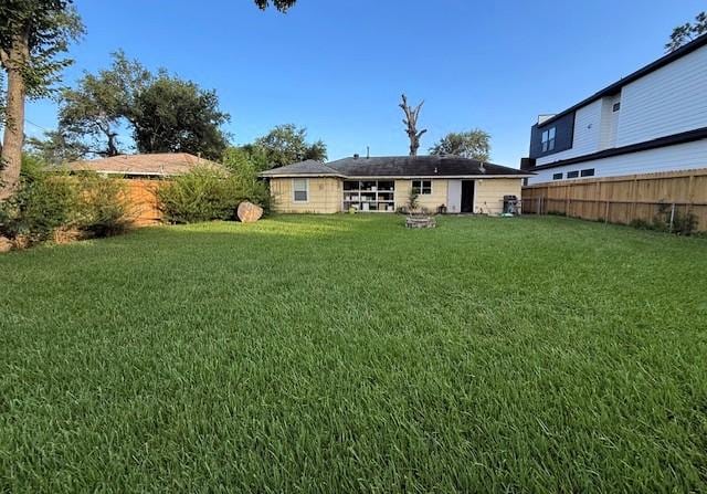 8050 Montridge Dr, Houston, TX 77055 - rear view of house featuring a fenced backyard