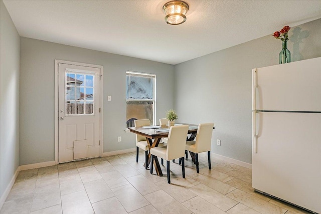 215 Peaceful Haven Way, Hutto, TX 78634 - dining space with baseboards