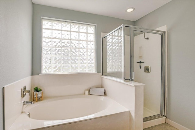 215 Peaceful Haven Way, Hutto, TX 78634 - full bath featuring a stall shower and a garden tub