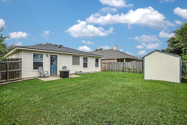215 Peaceful Haven Way, Hutto, TX 78634 - back of property with a fenced backyard, a patio area, and a storage unit