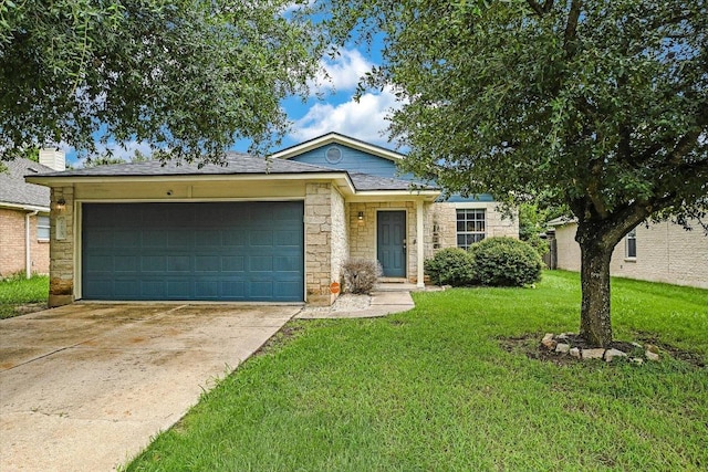 215 Peaceful Haven Way, Hutto, TX 78634 - view of front of house with stone siding, concrete driveway, an attached garage, and a front yard