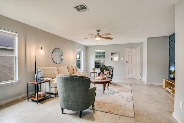 215 Peaceful Haven Way, Hutto, TX 78634 - living room with ceiling fan and light tile patterned flooring