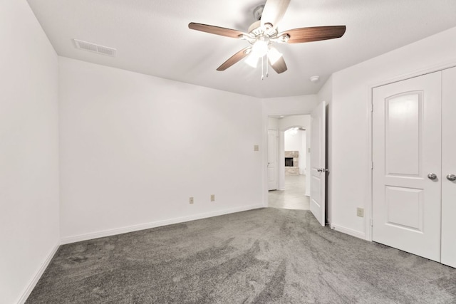 851 Stone Mountain Dr, Marble Falls, TX 78654 - unfurnished bedroom featuring carpet and ceiling fan