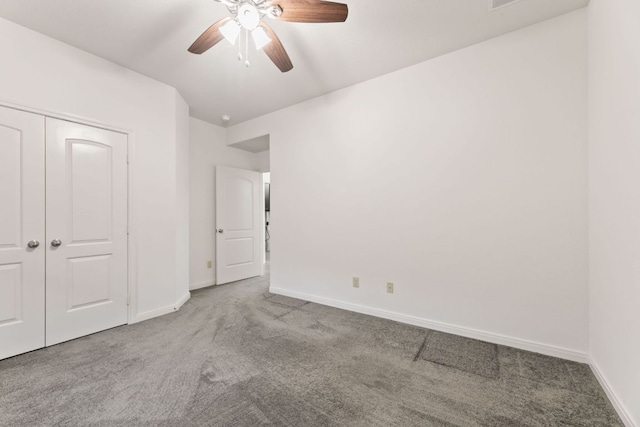 851 Stone Mountain Dr, Marble Falls, TX 78654 - unfurnished bedroom featuring carpet floors, a closet, and ceiling fan