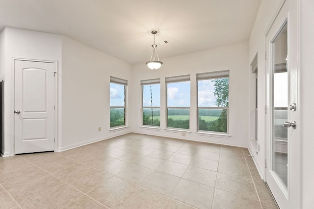 851 Stone Mountain Dr, Marble Falls, TX 78654 - spare room with light tile patterned floors and baseboards