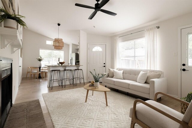 701 Mankato Dr, Austin, TX 78748 - living area with healthy amount of natural light, lofted ceiling, a ceiling fan, and wood finished floors