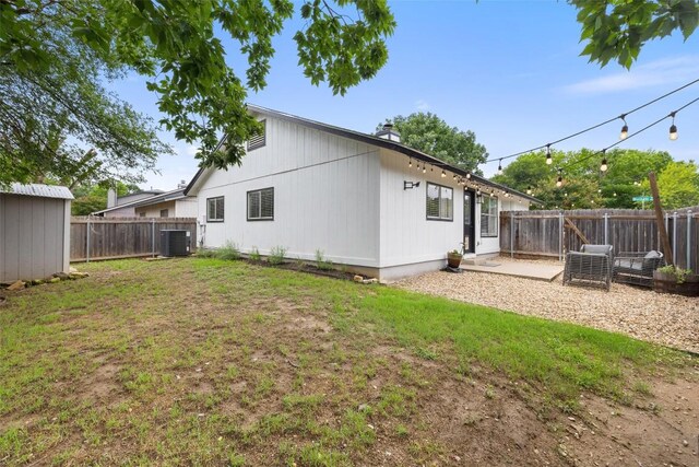 701 Mankato Dr, Austin, TX 78748 - rear view of house featuring a fenced backyard, a patio, and a storage shed