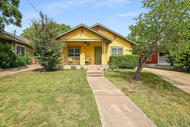 7312 Meador Ave, Austin, TX 78752 - view of front of house featuring covered porch, a ceiling fan, and a front yard
