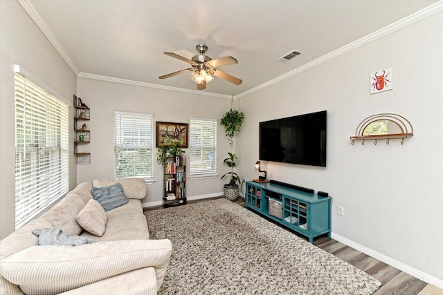 7312 Meador Ave, Austin, TX 78752 - living room with ceiling fan, crown molding, and wood finished floors