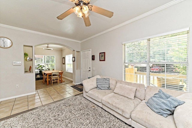 7312 Meador Ave, Austin, TX 78752 - tiled living room featuring arched walkways, a ceiling fan, and ornamental molding