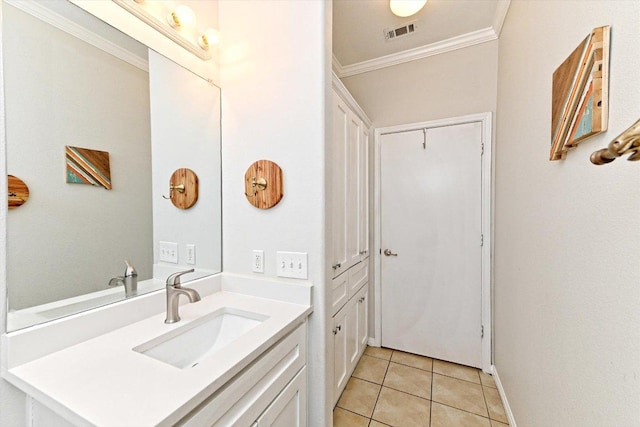7312 Meador Ave, Austin, TX 78752 - bathroom featuring crown molding, vanity, and tile patterned floors