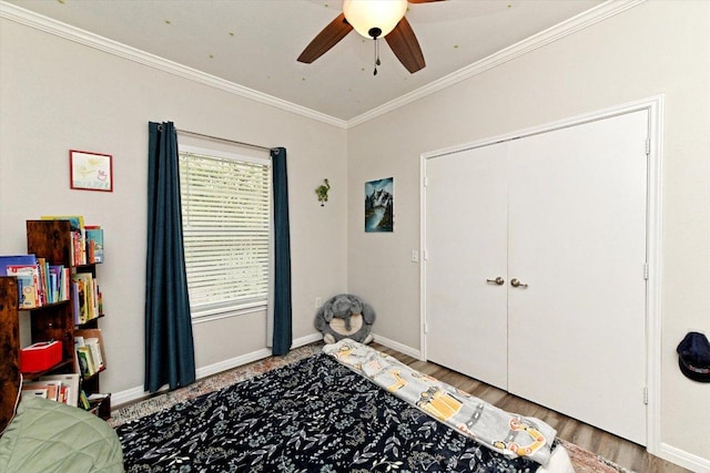 7312 Meador Ave, Austin, TX 78752 - bedroom featuring ornamental molding, ceiling fan, and wood finished floors