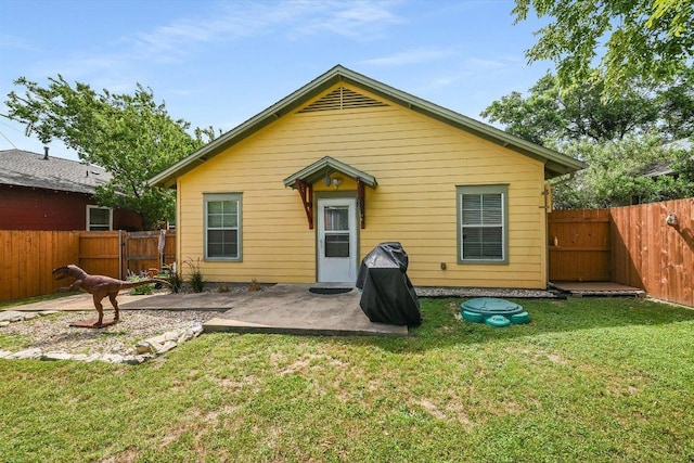 7312 Meador Ave, Austin, TX 78752 - back of property with a patio and a fenced backyard