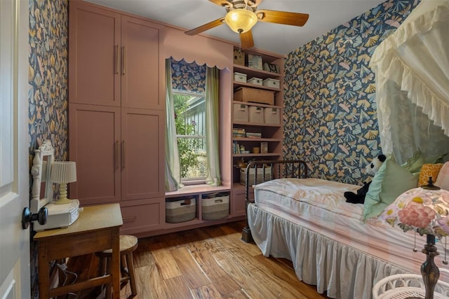 79 Saddle Rock Rdg, Wimberley, TX 78676 - bedroom featuring wallpapered walls, light wood-style flooring, and ceiling fan